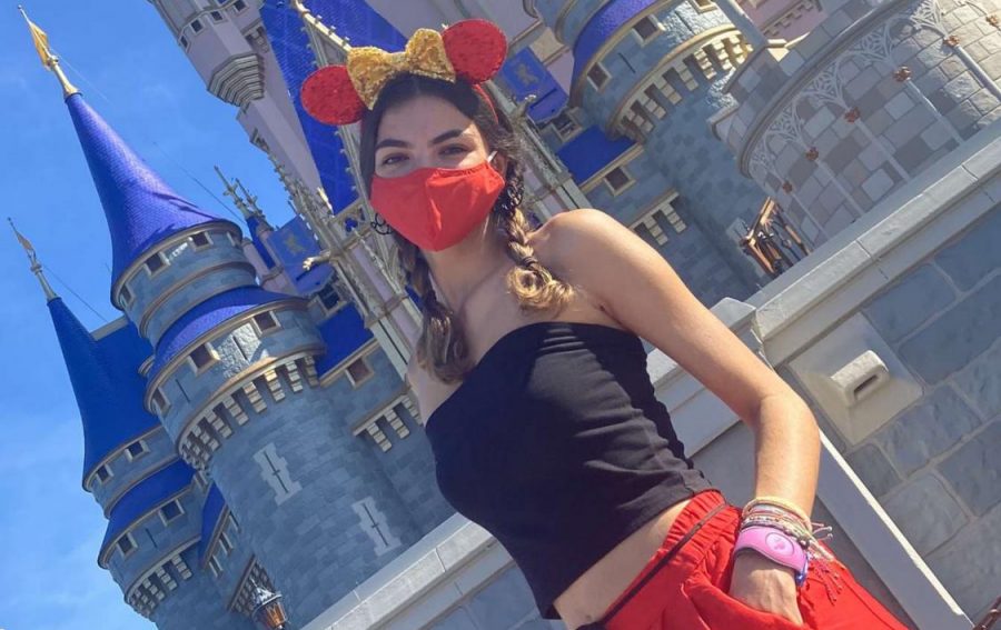 Julianna posing in front of Cinderellas Castle at Magic Kingdom
