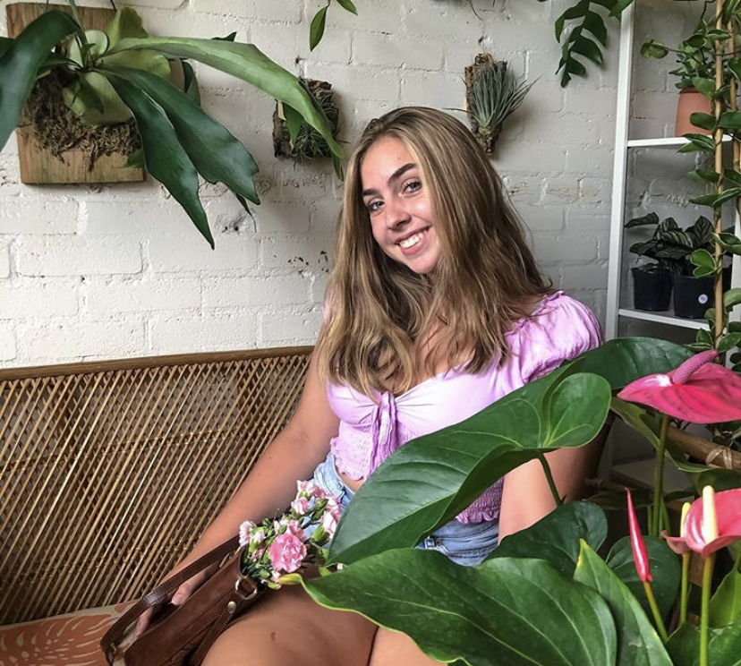 Sofia at a flower shop looking for a small plant