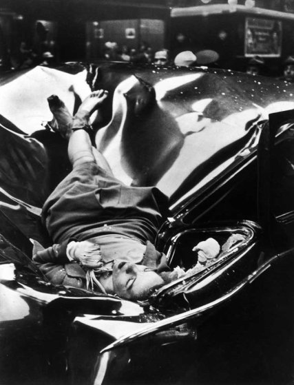 The body of 23-year-old Evelyn McHale rests stop a crumpled limousine minutes after she jumped to her death from the Empire State Building, May 1, 1947.The photo is from Times.com and photo  was taken by Robert Wiles 