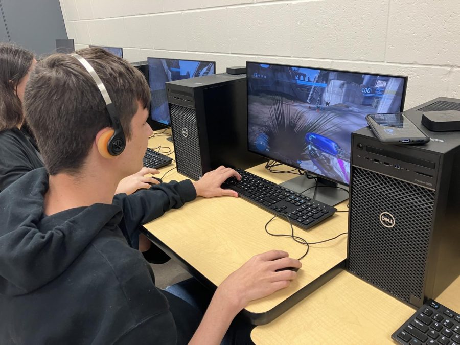Two students taking part in friendly competition at the Sunlake gaming club. Communication is important to winning the match!