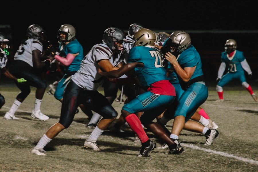 Pictured is Junior Brent Clements (Number 28) going head to head with Wiregrass in last nights game.