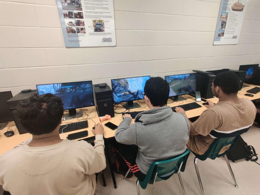 Adrian Cangas the clubs president, on the left, playing Halo with other club members.