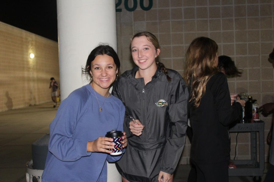Pictured is senior, Maddie Haynes (left) and sophomore, Olivia Cataldo (right) helping out at the hot chocolate stand.