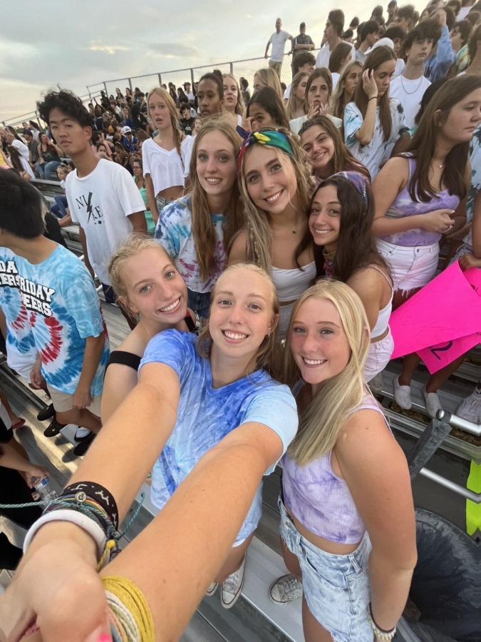 Pictured is Seniors Noelle Oparka, Brooke Bachus, Ashley Vandiver, Erin Vandiver,Mackenzie Kaiser, Genevieve Garcia, and Caitlyn Crossley at the tie dye out football game, waiting for the game to start in the student section.