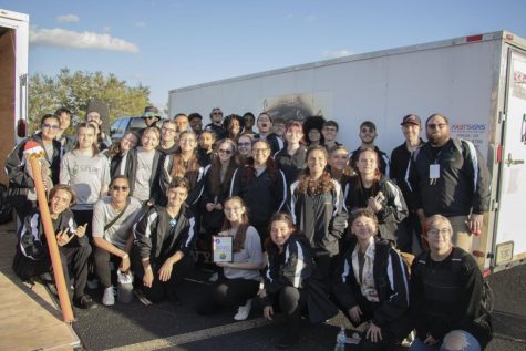 The percussion ensemble groups together at their trailer after taking first place.
