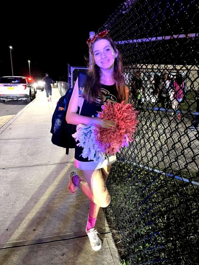 Pictured is Olivia after cheering at one of the Sunlake football games.