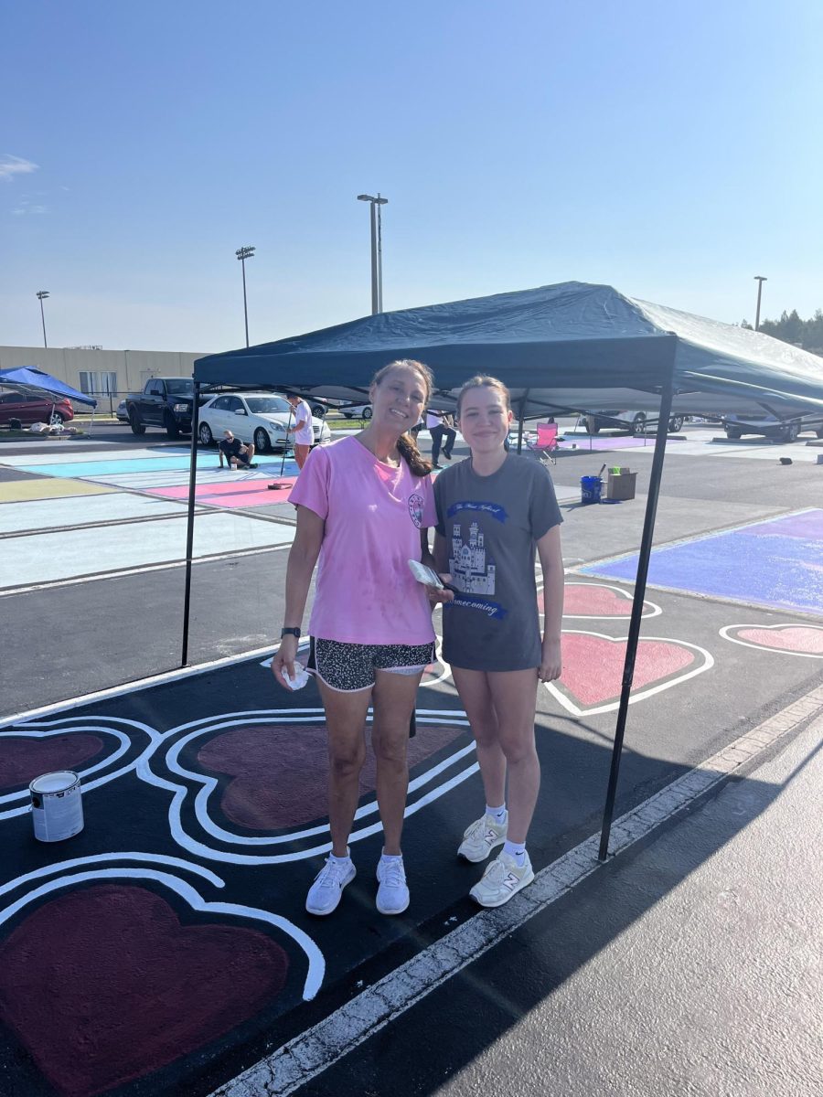 Zoe Bastable and her mom, Mrs. Camper, working on Zoes parking spot.