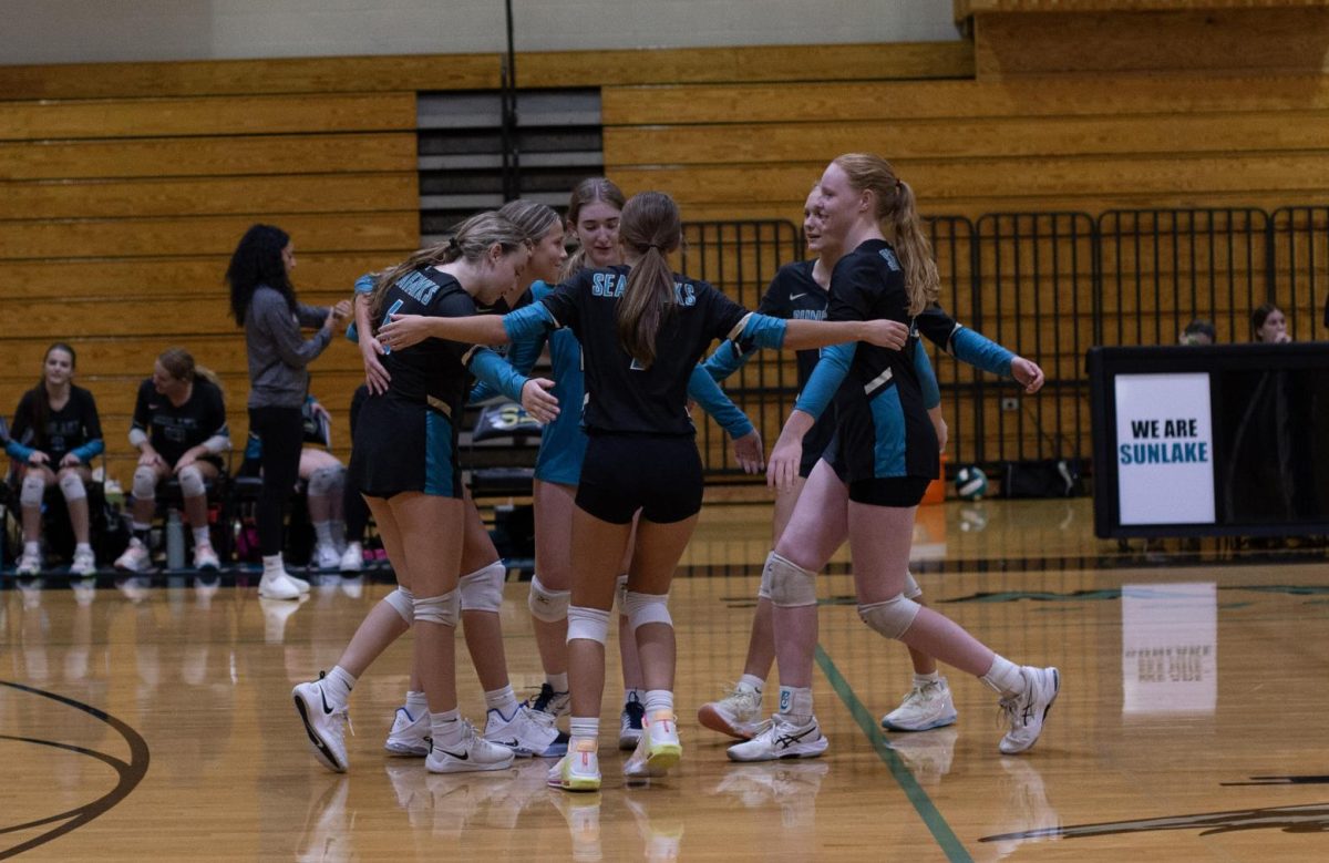 The team celebrating a point after a long rally. They were ready to compete for a win against their rivals, Land O Lakes High School.