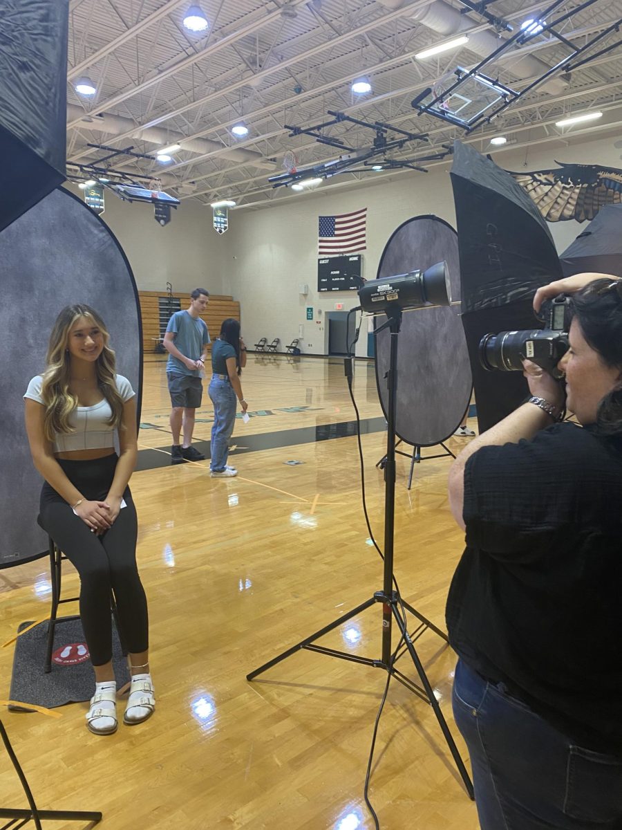 Here you can see Samantha Mizak getting her school picture taken. Pictures were taken place in the gymnasium. When asked on her feelings about it she said I was very excited. 