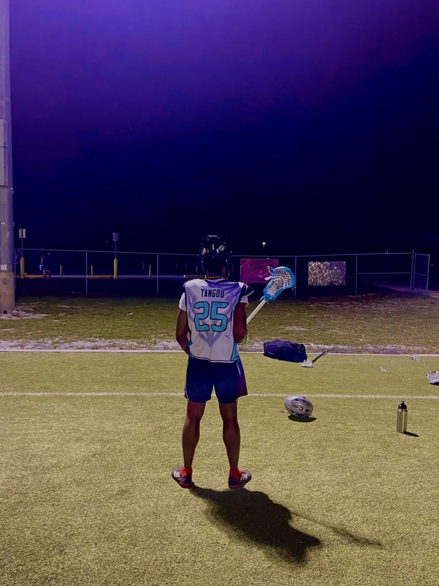 Junior Tangou, 11th grade Sunlake student, practicing lacrosse at organization called Fall Ball with other student lacrosse players from neighboring schools.