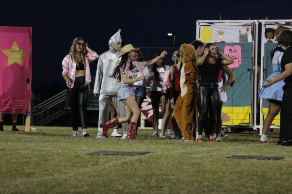 Sunlake seniors dressed as characters from The Wizard of Oz and performing their senior skit for their last Homecoming week.