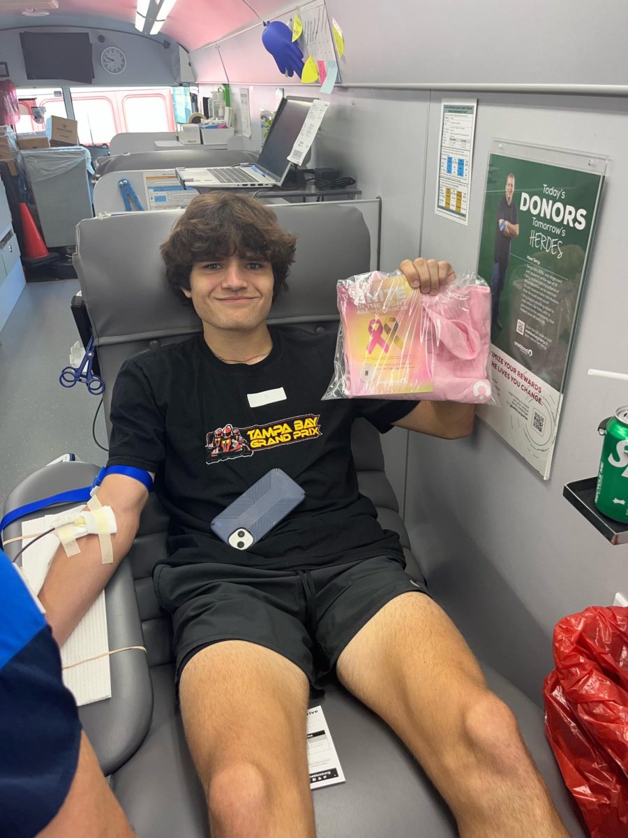 Dylan during the blood drive. He was very proud of his shirt that was given as a thank you for donating.