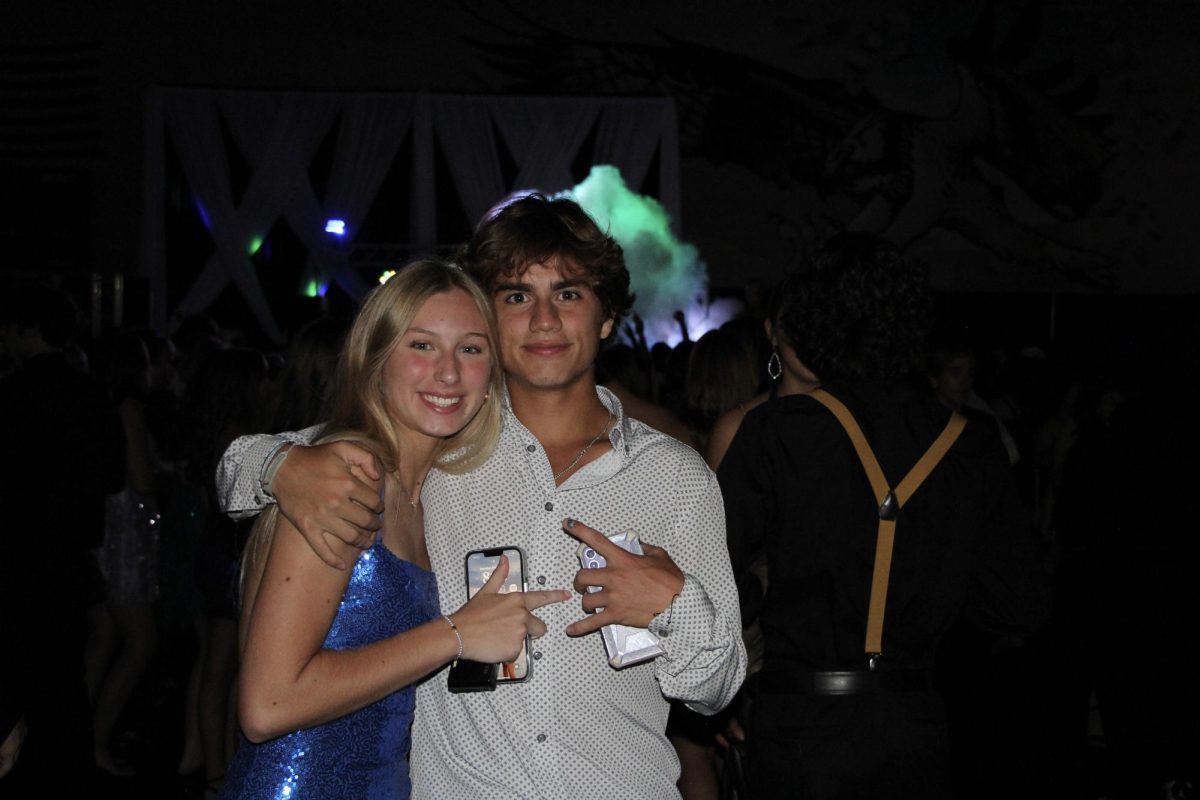 Matias Gonzalez and Lexi Tschopp in the gym at the homecoming dance. The gym is where the main dance happens and pictures are taken.