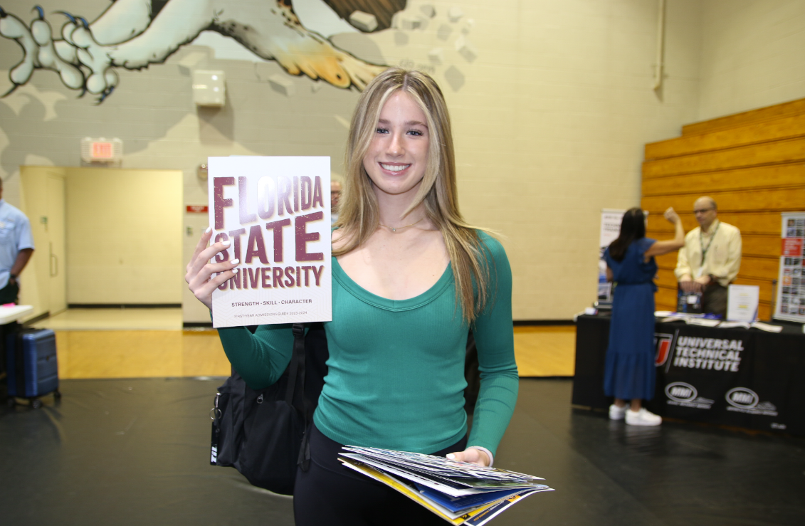 Emma with one of the information booklets at the Florida State University table.