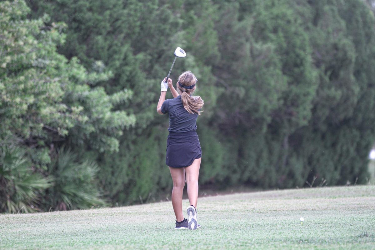 Sophomore Nevaeh takes a swing at her home meet at Heritage Harbor. 
