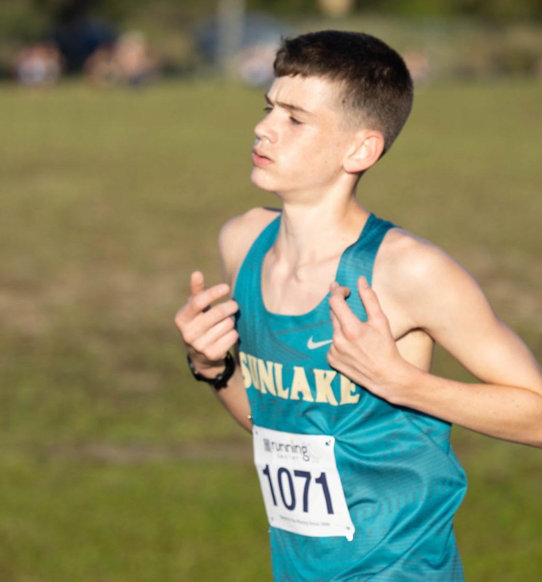 This is Jadon near the end of the race, pushing to the finish. Jadon has "...been running since track season my freshman year. I would run a lot at soccer practice and my Coaches suggested that I should try running as a sport. Now I love it."