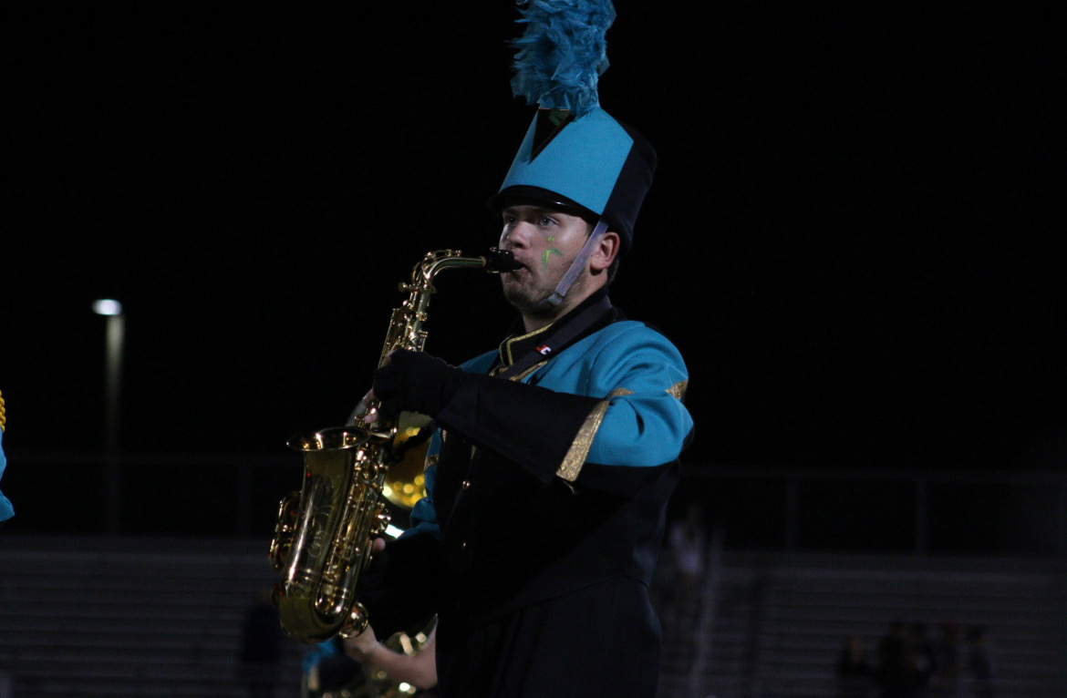 Freshman Micah Harper playing in the band performance for Butter Bowl. Harper plays alongside friends and classmates, using musical skill and strength. This is only his first year playing in high school, but he has a bright future ahead.