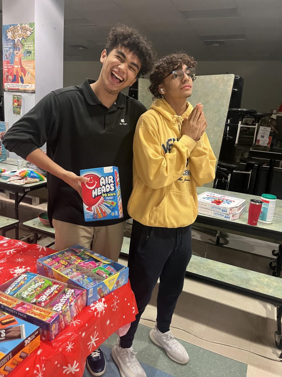 Daniel Garcia and Samuel Chacon volunteering at concessions for Rushe Middle Schools Movie Night.