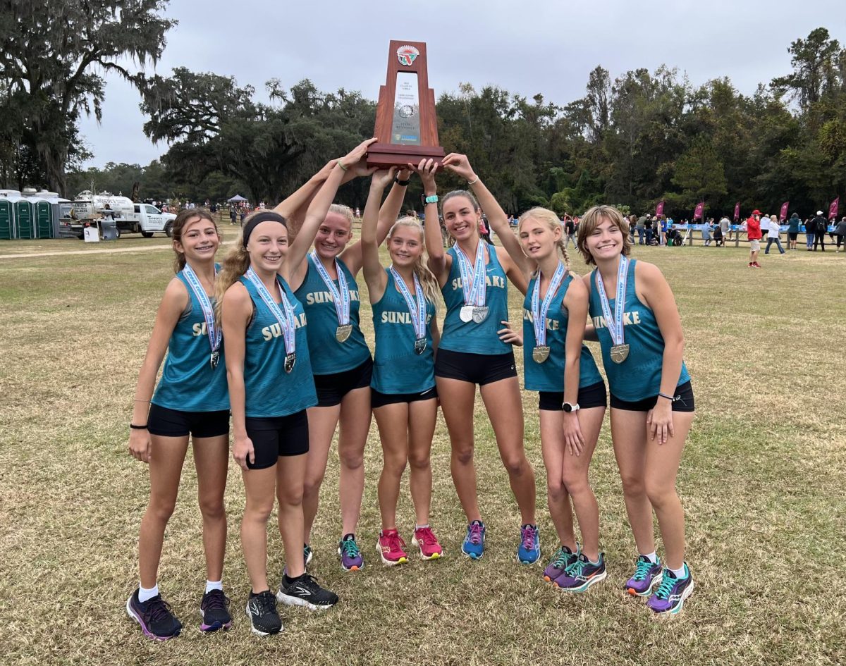 This is the Sunlake girls with their state medals, holding up the state trophy. Kaitlyn explains, “Our team ended up getting State Runner Up, which we were all very excited about because it had been our long term season goal to get on the podium at states. We out so much effort in to get there and I’m so proud of my team.”