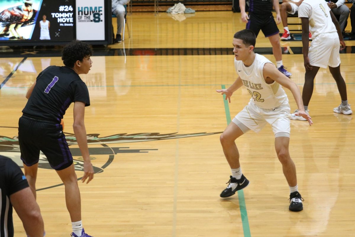 Junior George Clark guarding a River Ridge player. The Seahawks won this game but continue to work hard in order to play at their full potential. George shared, I feel like the team and I have preformed well this season although we should have won some games that we lost. 