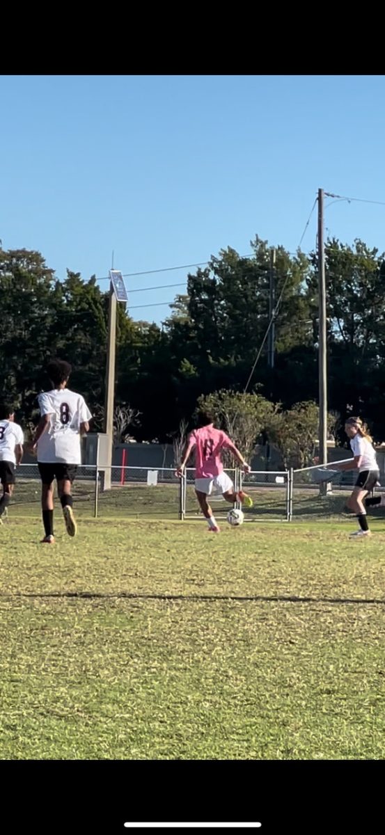 Freshman Aidan Soto number 11. A picture of Aidan during his soccer game moments before scoring a goal. Aidan stated, It felt so good to score a goal.