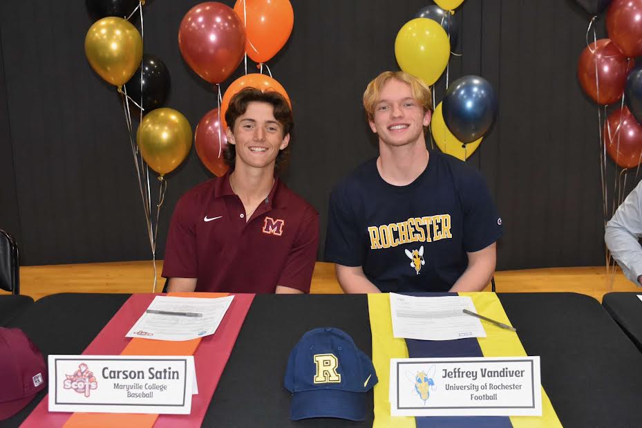 Seniors Carson Satin and Jeffrey Vandiver on National Signing Day, excited to officially be signed to their schools for athletics.