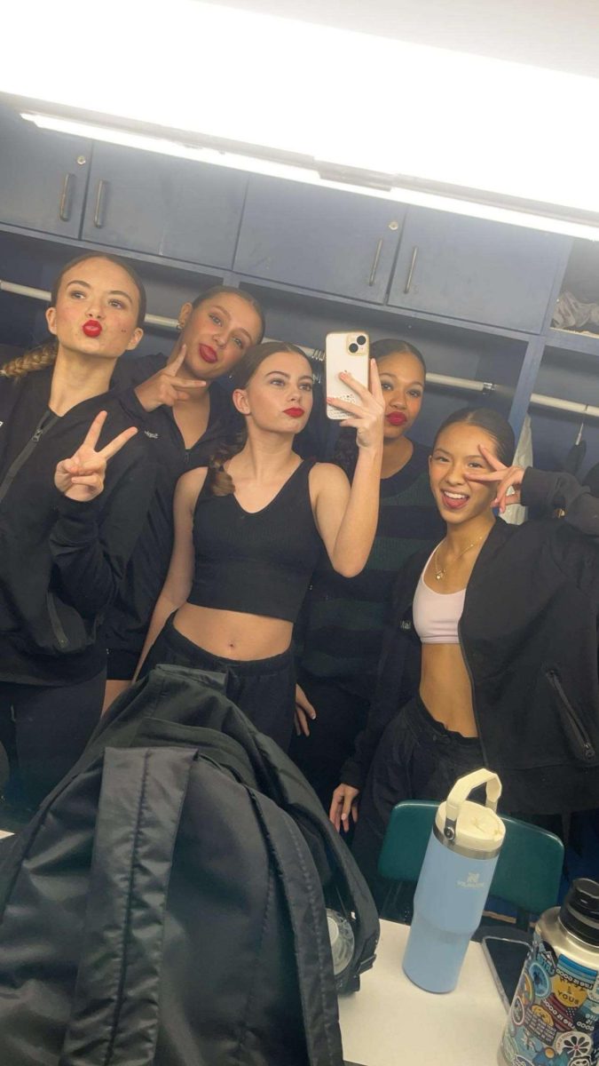 Freshman+Marie+Cartwright+is+the+one+holding+the+phone.+This+picture+was+taken+right+after+she+performed+at+her+showcase.+Marie+states+We+killed+are+dances+and+Im+so+proud+of+my+team.