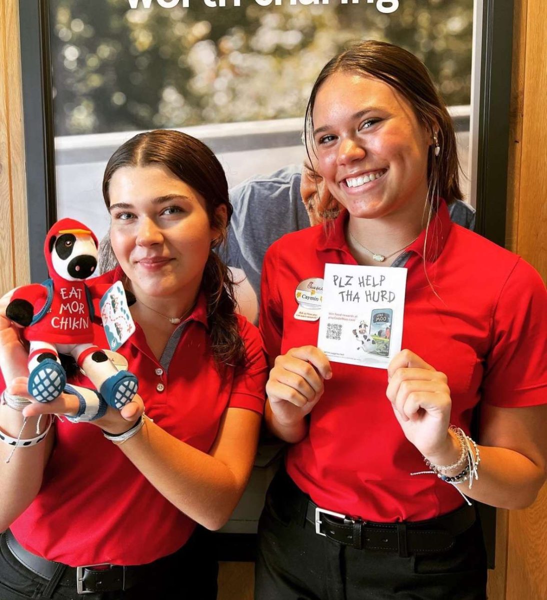 Junior Caymin Fox in her Chick-fil-A uniform with her co-worker Alicia.