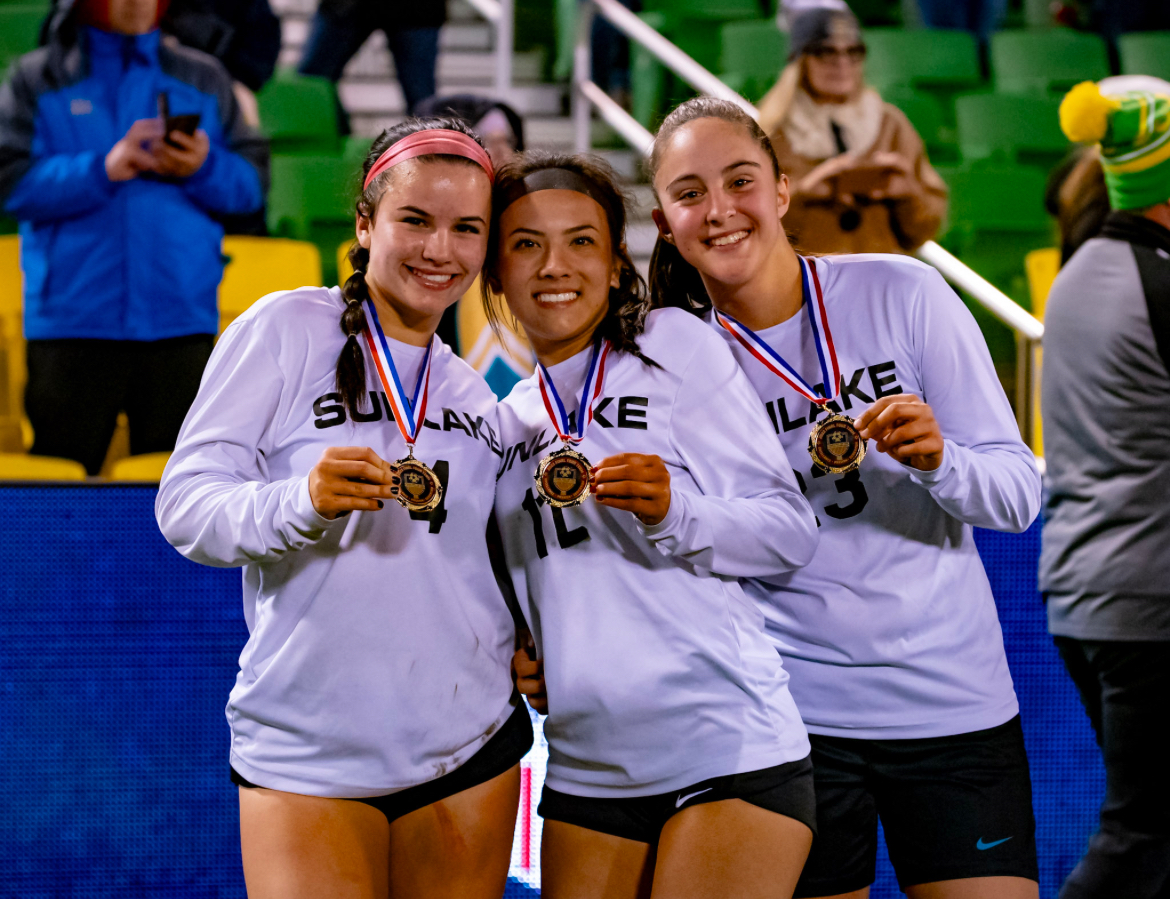 Junior Madylena Perez is seen here posing with a couple of her friends with the metal they got after they won the game. I get along with everyone on my team but I absolutely love playing with my two best friends, Campbell and Bianca. Campbell is seen on the left side of Mady, but Bianca is not in this photo. 