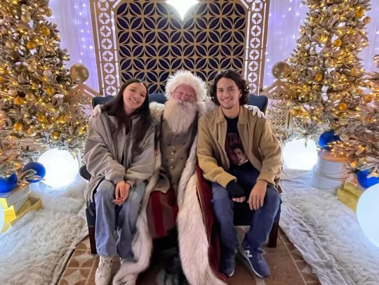 Matthew and his girlfriend at St Pete’s Enchant sitting with Santa. We got to meet Santa again after not seeing him since 4th grade, Matthew said, explaining the photo.