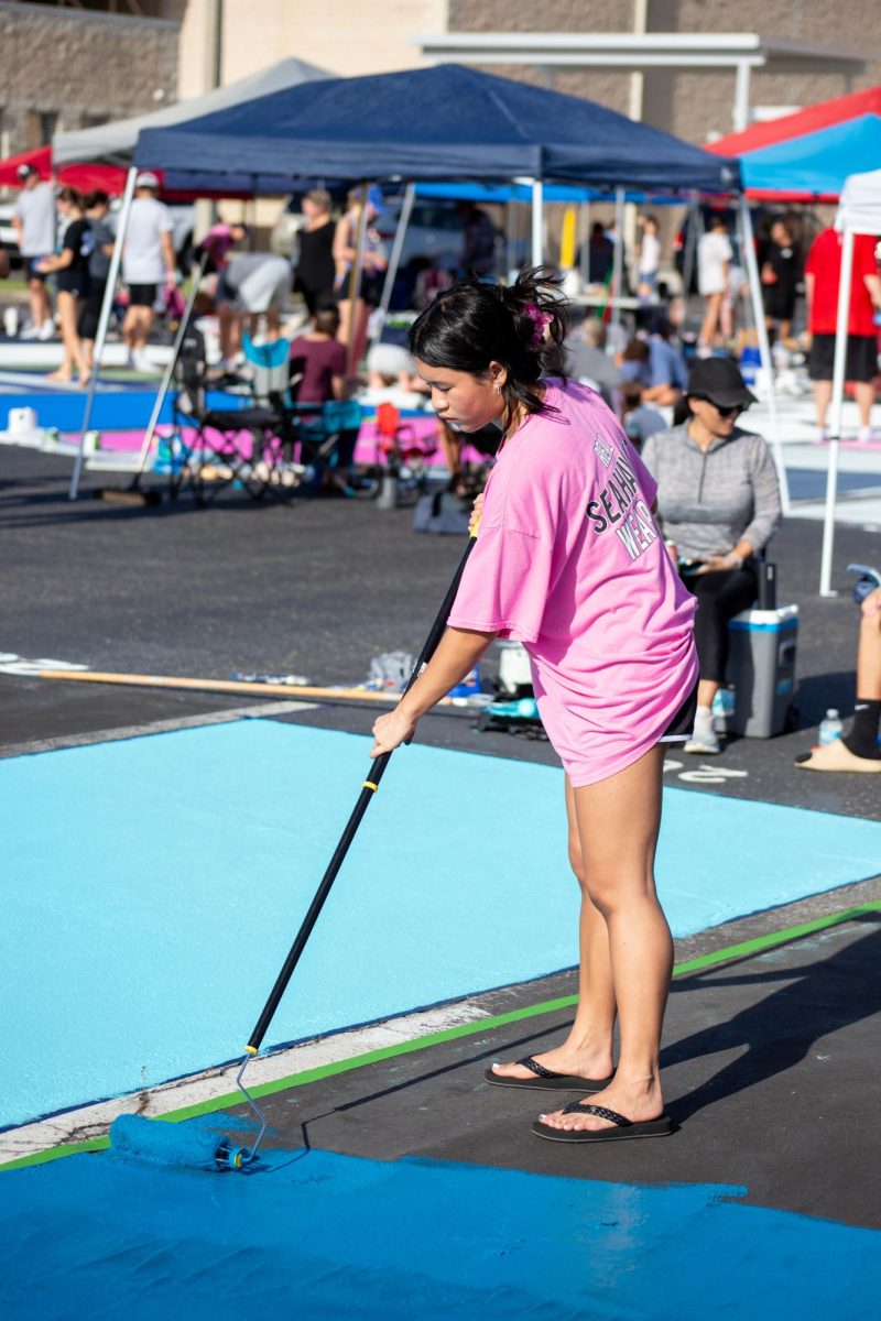 Amelia working hard to complete her spot. She knows there is limited time so she has to work fast. She is excited to finish her spot that will commemorate her whole Senior year.