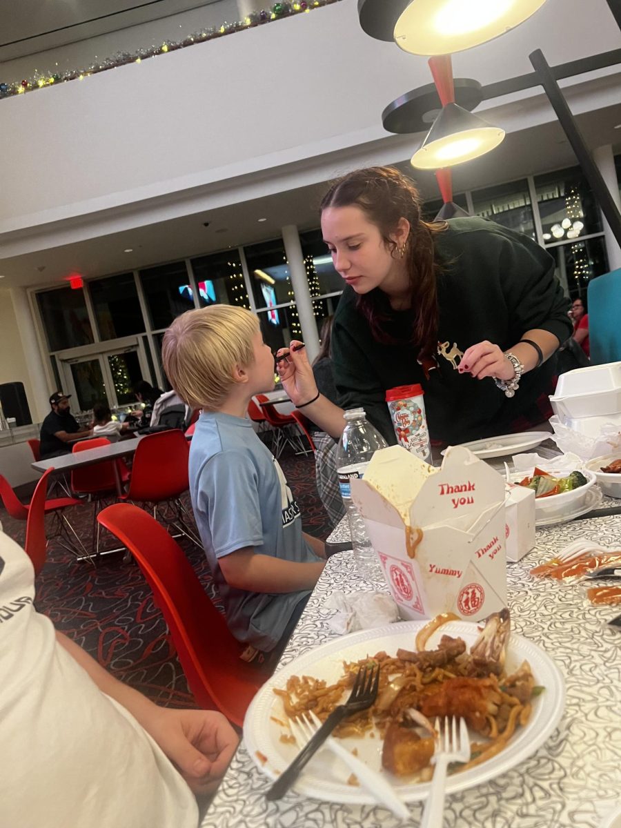 Ramsey feeding her little cousin at Universal Studios.