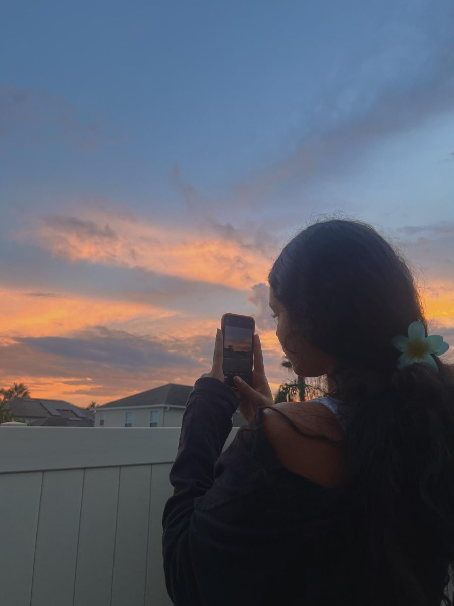 Vanessa taking a picture of the beautiful sunset.