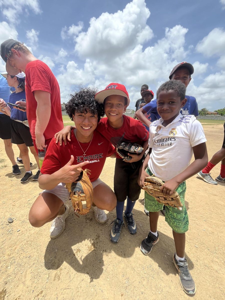 Noah Sagnip (senior) in a picture with local children in La Victoria, Domican Republic. 