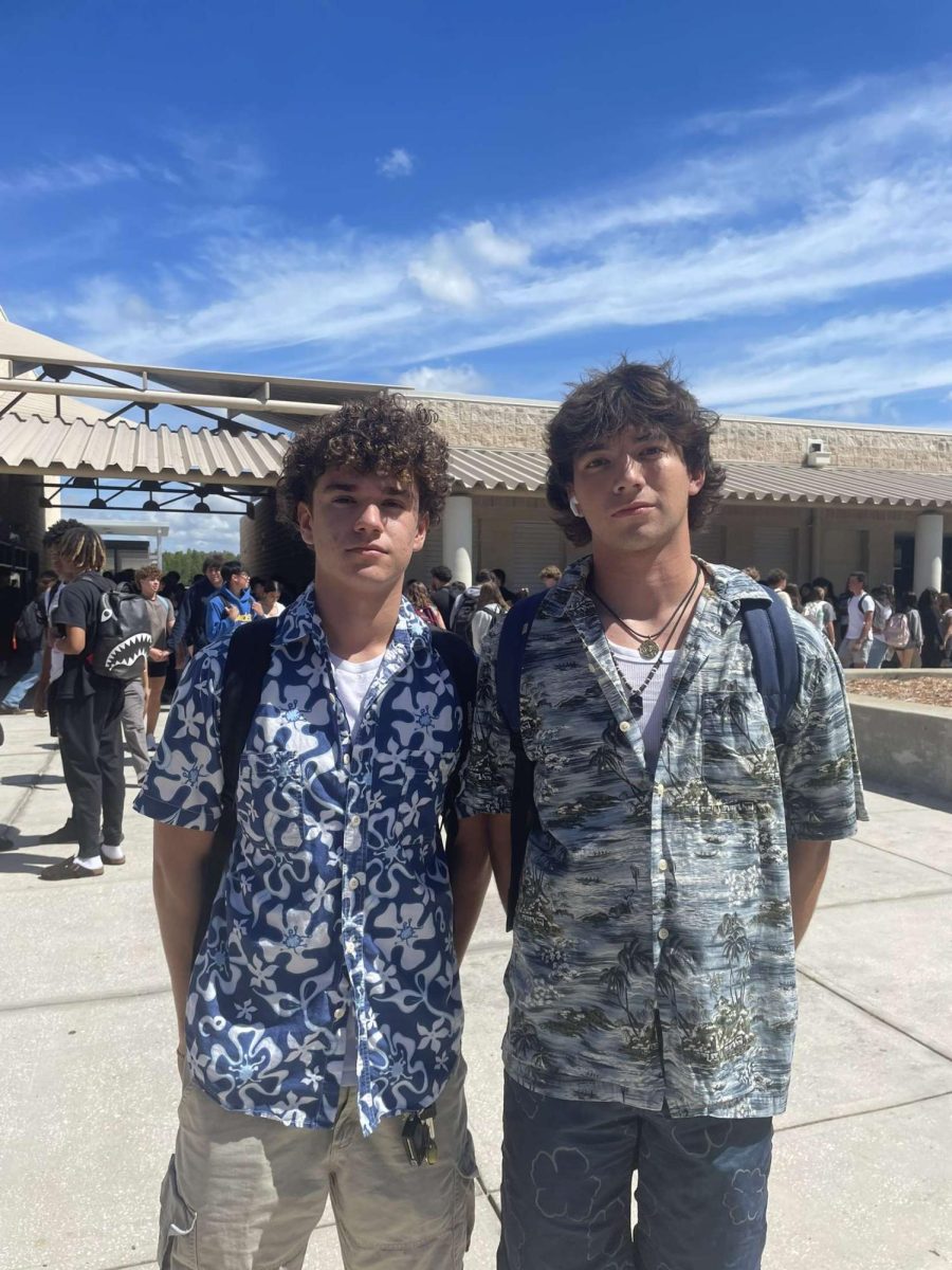 Senior, Allister Boostrom is on the right. Allister is standing next to his friend Tomas Torrado taking a picture of their beach outfits for PBIS spirit week. Allister states, "I enjoyed participating in PBIS spirt week."