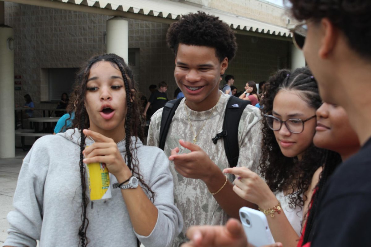 Senior Jared Ryder and other Sunlake High School students at club fair during lunch. They are speaking to club leaders and getting to know what clubs we have at Sunlake.