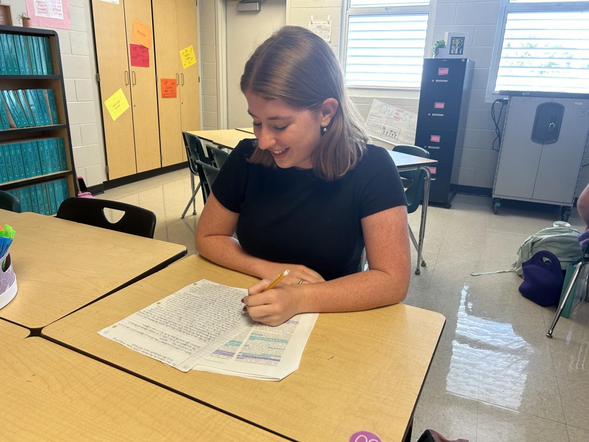 Eliza Lammers, 11th; 
Here, Eliza is working on her paper for women's health rights. 