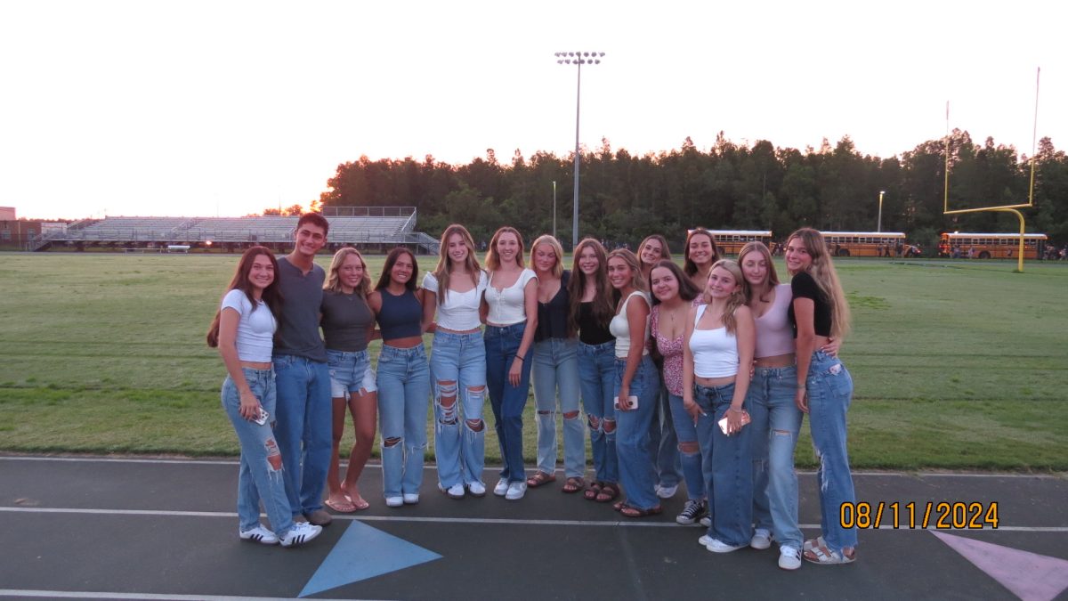 Senior, Kate Beaudin and her friends enjoying senior sunrise at the Sunlake football stadium. 