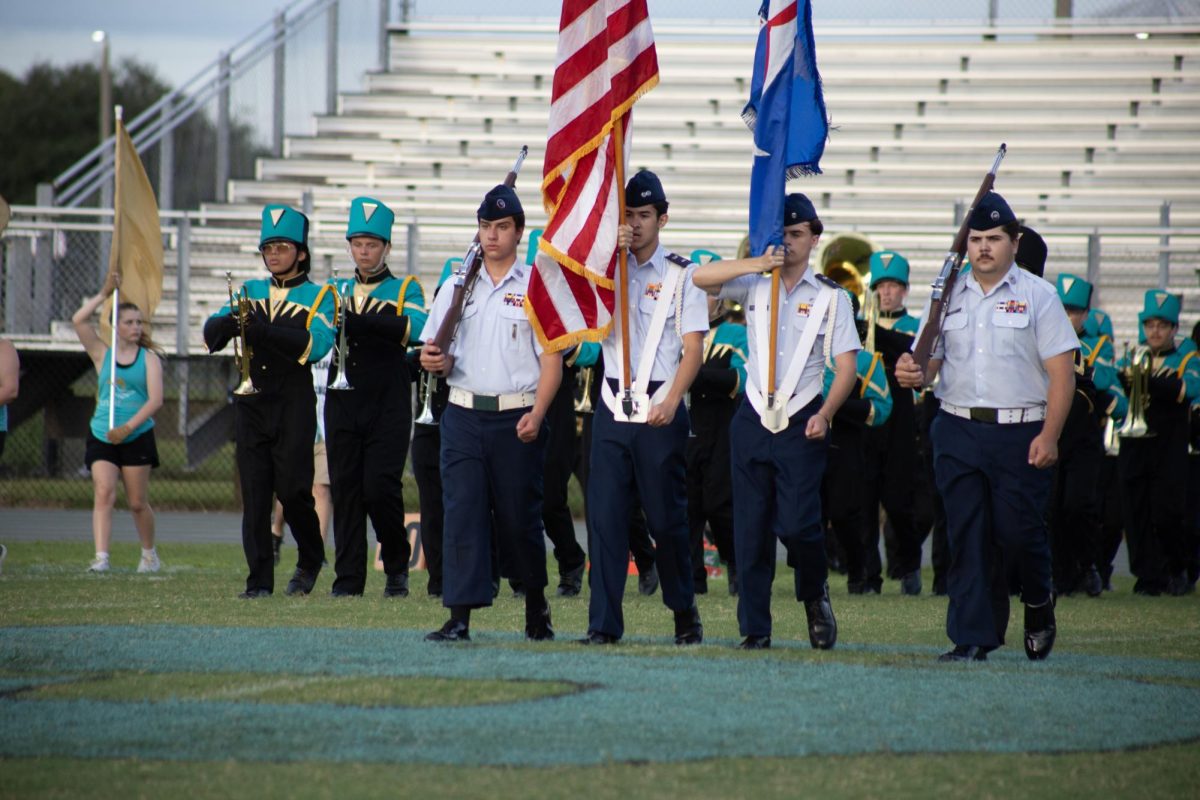 Christopher Claudio, Senior; not only participates in band but is also a part of the Civil Air Patrol. He held the American Flag at the start of the first home football game.