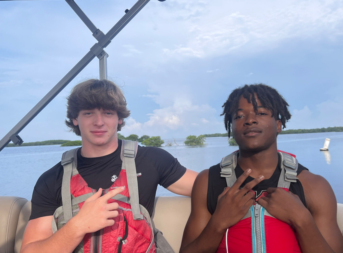 Junior, Matthew Madley (Left), and Senior, Junior (Right) after getting on the boat.