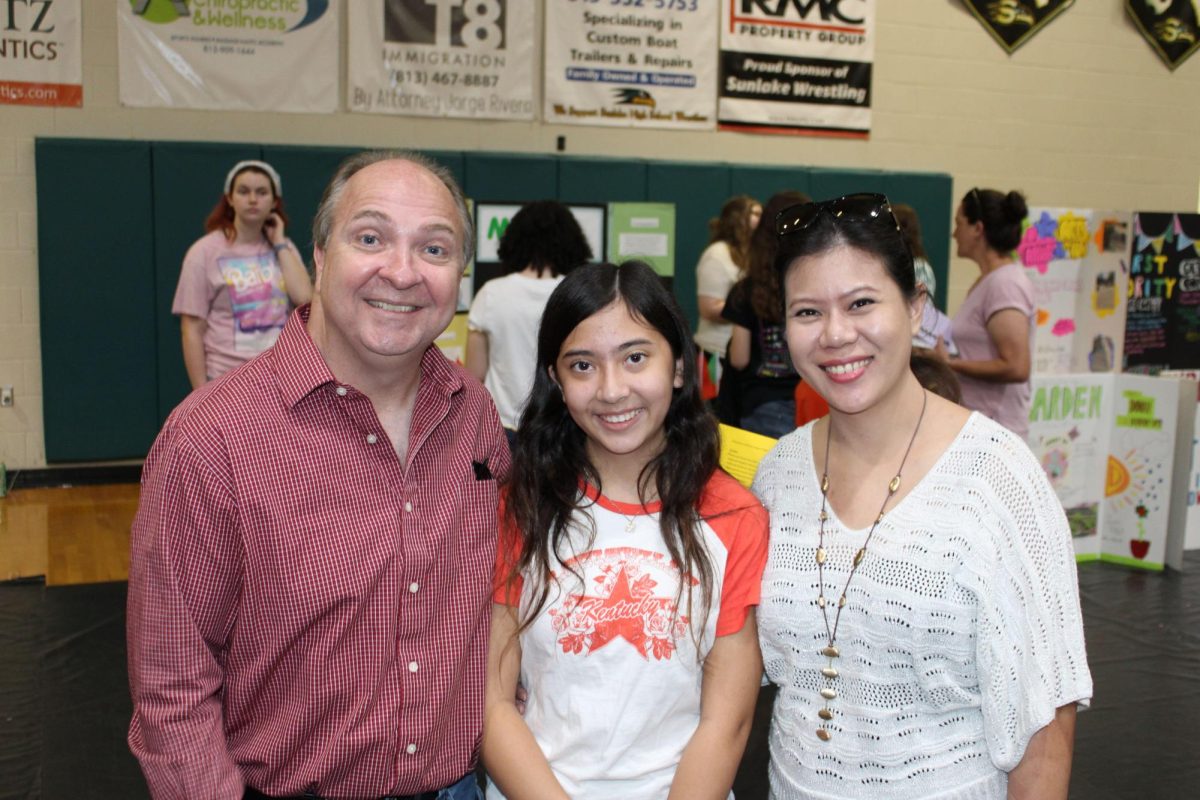 Maryanne is with her parents at freshmen orientation smiling from ear to ear. She was Intrigued by the different opportunities clubs and athletic teams have. 