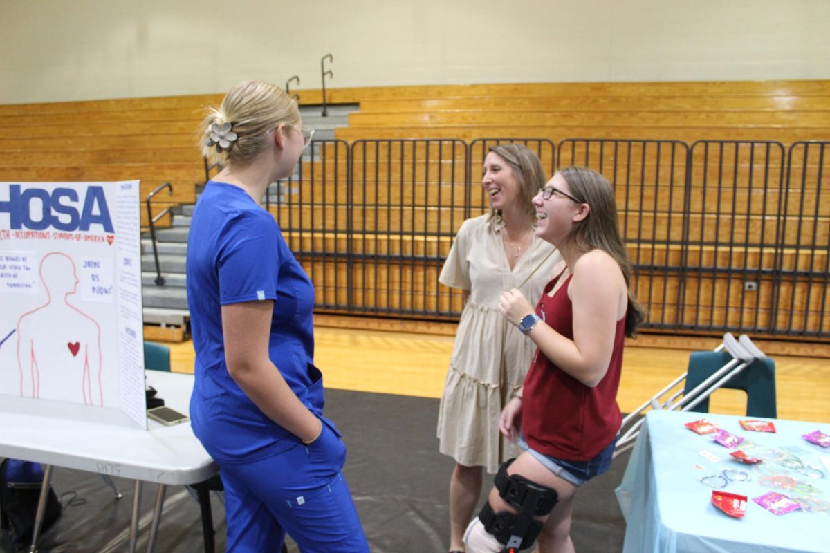 Christina Bradberry introducing a freshman to HOSA at orientation. She is really excited to be HOSA president this year. 