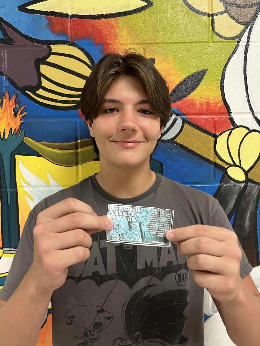 Jackson Heaton, junior, holding his Blaze Pizza coupon after spinning the Blaze Pizza prize wheel during lunch. Week of September 9th-13th. 