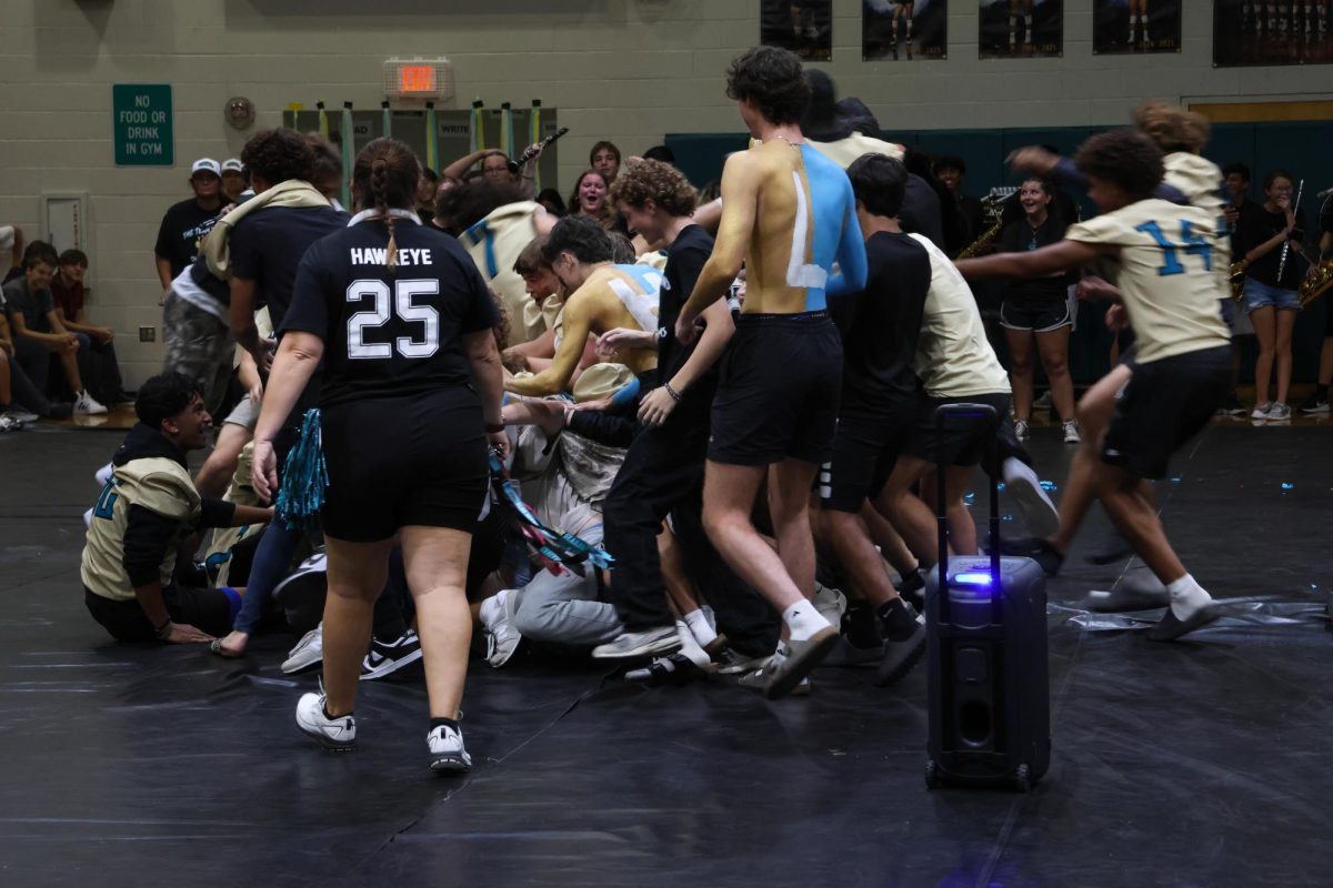 All the students jumping over each other for a chair during musical chairs