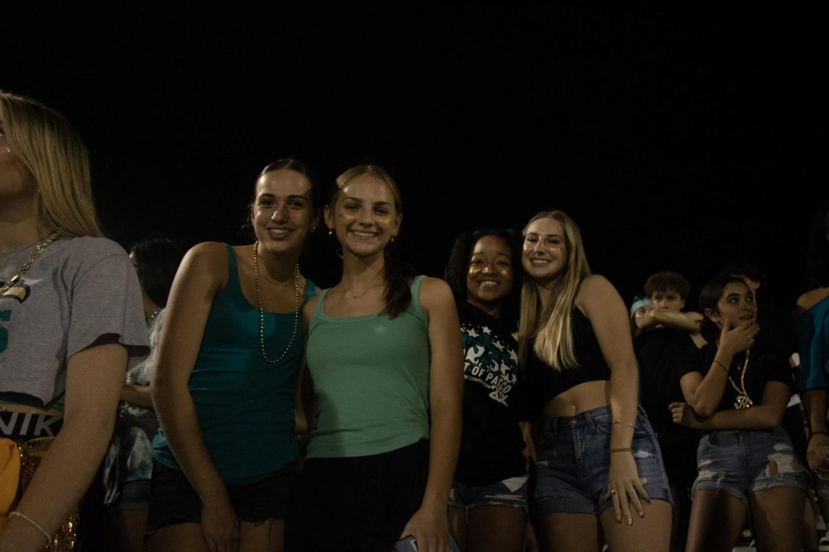 Allison Poll (right) spending time with her friends at the Homecoming Football game. 