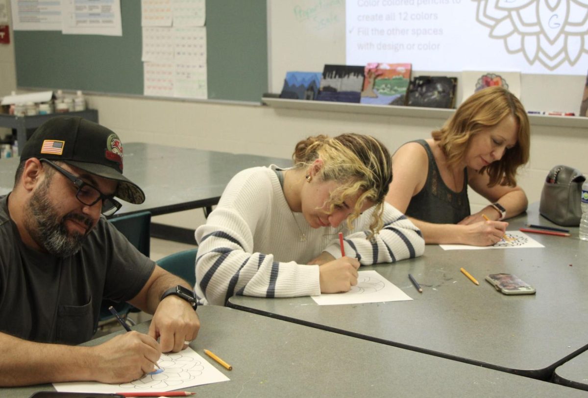 Caitlin Coll went to Open House, got to talk to teachers, and create some artwork with her parents. 