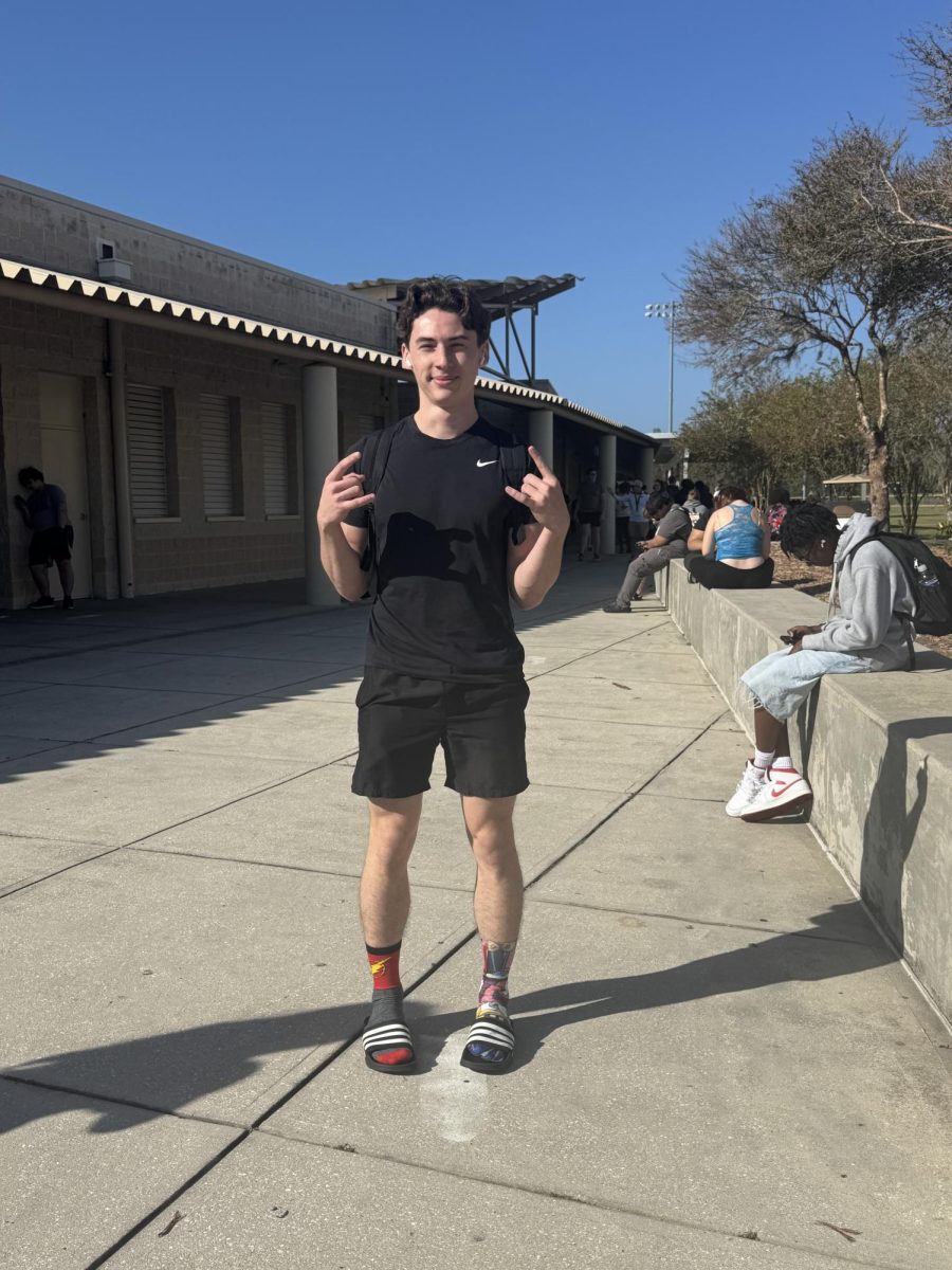 This is a picture of senior Damon Rooney participating in Red Ribbon Week. Damon is wearing a SpongeBob and a flash sock for "Sock it to drugs" day. Damon states "I participated to draw awareness to my peers about the dangers of drugs."