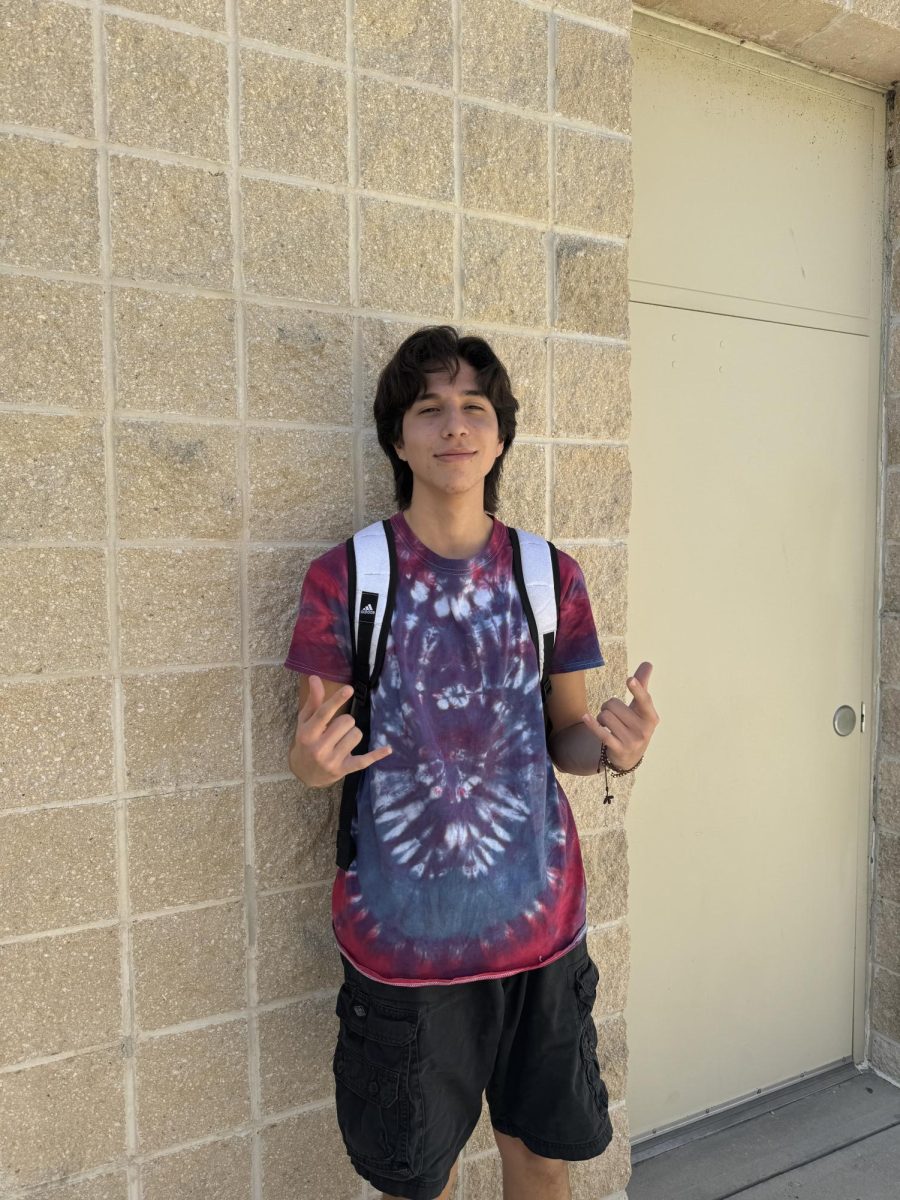 Senior, Mateo Munoz showing off his shirt for Red Ribbon Week.