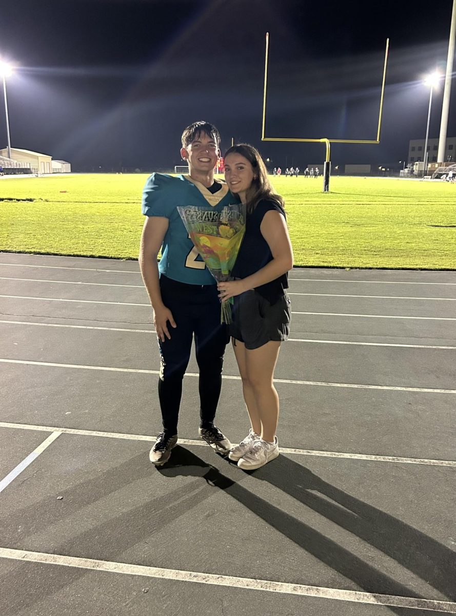 Cadyn Larscheid and Michel Capdevila posing for a cute photo after the amazing Hoco proposal surprise.