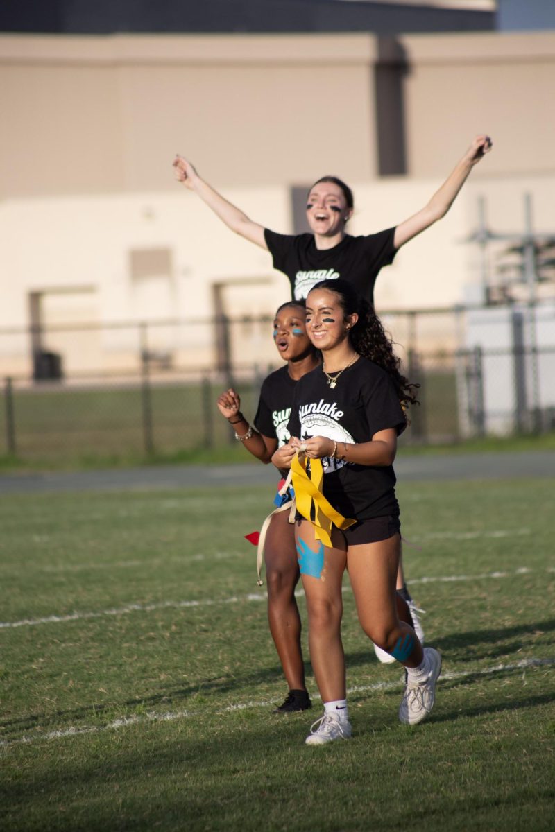 Arylyn running off the field. She said, "I loved it!" She was very excited for the games.